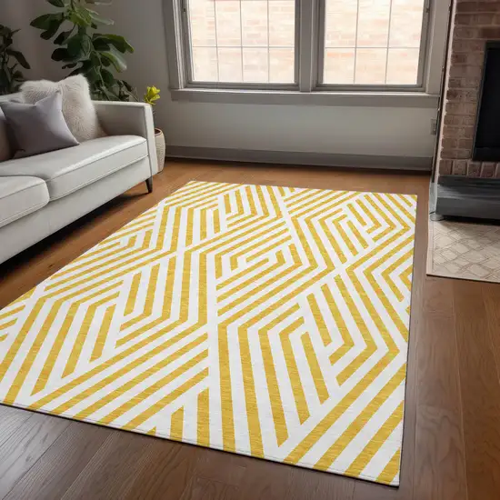 3' X 5' Gold and White Geometric Washable Non Skid Indoor Outdoor Area Rug Photo 8