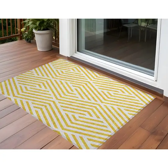 3' X 5' Gold and White Geometric Washable Non Skid Indoor Outdoor Area Rug Photo 1