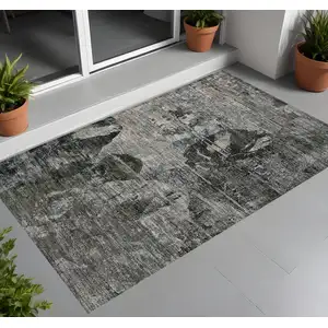 Photo of 3' X 5' Gray Dark Green and Black Floral Washable Non Skid Indoor Outdoor Area Rug