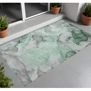 Photo of 3' X 4' Green Abstract Washable Non Skid Indoor Outdoor Area Rug