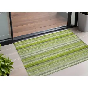 Photo of 3' X 5' Green Striped Washable Non Skid Indoor Outdoor Area Rug