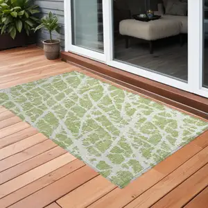 Photo of 3' X 4' Green and White Abstract Washable Non Skid Indoor Outdoor Area Rug