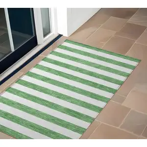 Photo of 3' X 5' Green and White Striped Washable Non Skid Indoor Outdoor Area Rug