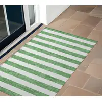 Photo of 3' X 5' Green and White Striped Washable Non Skid Indoor Outdoor Area Rug