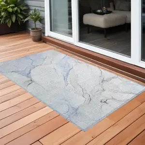 Photo of 3' X 4' Ivory Blue and Gray Abstract Washable Non Skid Indoor Outdoor Area Rug