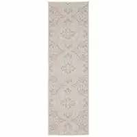 Photo of 2' X 7' Ivory Floral Stain Resistant Indoor Outdoor Area Rug