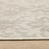 Photo of 6' X 9' Ivory Floral Stain Resistant Indoor Outdoor Area Rug