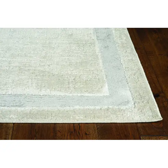 8'X11' Ivory Silver Machine Woven Bordered Indoor Area Rug Photo 1