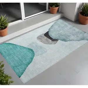 Photo of 3' X 5' Ivory Teal and Gray Abstract Washable Non Skid Indoor Outdoor Area Rug