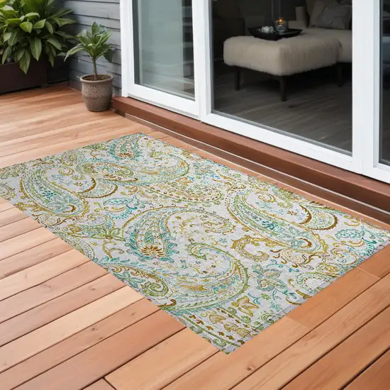 3' X 4' Ivory and Gold Paisley Washable Non Skid Indoor Outdoor Area Rug Photo 1