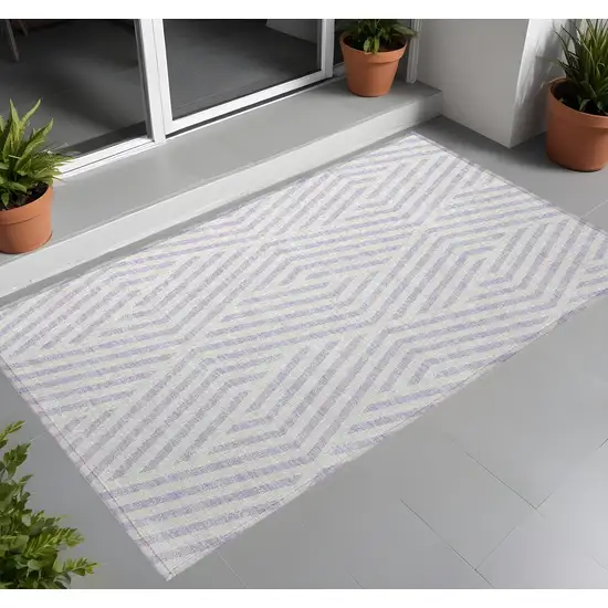 3' X 4' Lavender and Ivory Geometric Washable Non Skid Indoor Outdoor Area Rug Photo 1