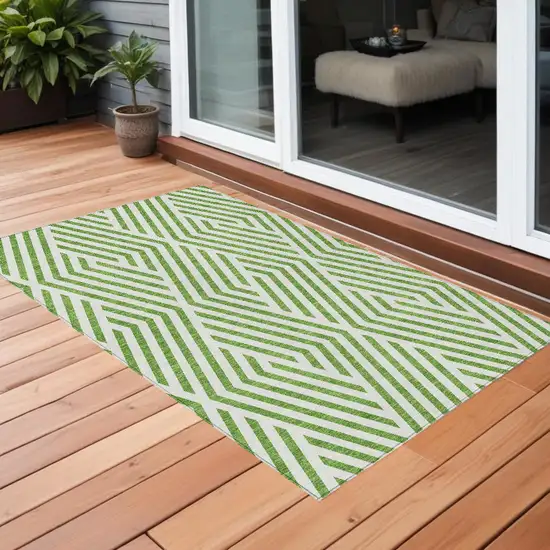 3' X 4' Lime Green and White Geometric Washable Non Skid Indoor Outdoor Area Rug Photo 1