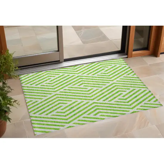 3' X 4' Lime Green and White Geometric Washable Non Skid Indoor Outdoor Area Rug Photo 1