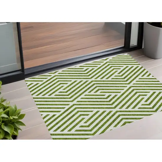 3' X 4' Lime Green and White Geometric Washable Non Skid Indoor Outdoor Area Rug Photo 1