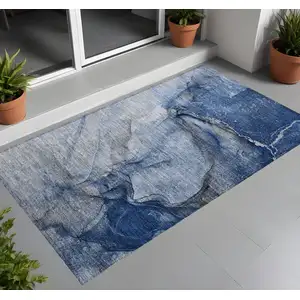 Photo of 3' X 5' Navy Blue Abstract Washable Non Skid Indoor Outdoor Area Rug