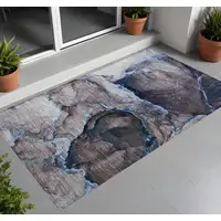 Photo of 3' X 5' Navy Blue Abstract Washable Non Skid Indoor Outdoor Area Rug