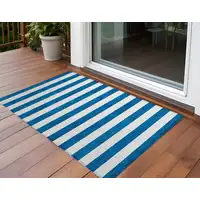 Photo of 3' X 5' Navy Blue Striped Washable Non Skid Indoor Outdoor Area Rug