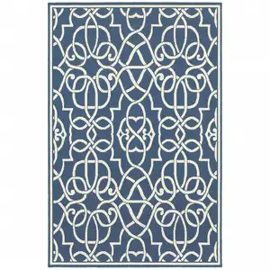 Photo of 6' X 9' Navy Geometric Stain Resistant Indoor Outdoor Area Rug