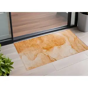 Photo of 3' X 4' Orange Abstract Washable Non Skid Indoor Outdoor Area Rug