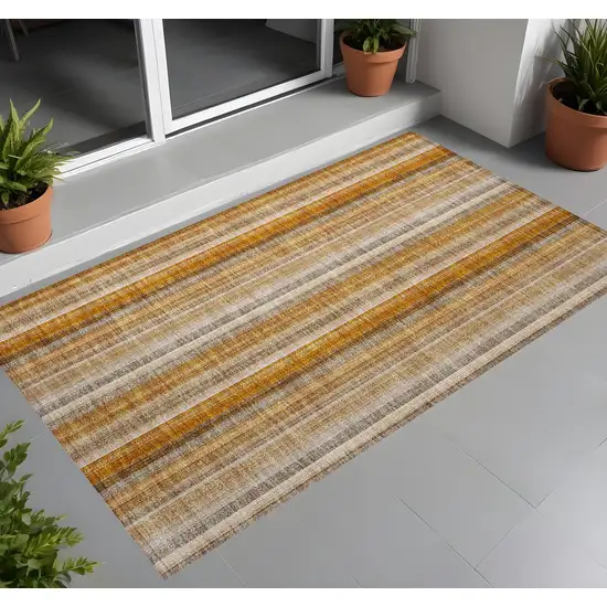 Orange Ivory and Gray Striped Washable Non Skid Indoor Outdoor Area Rug Photo 1