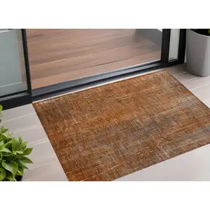 Photo of 3' X 5' Orange Striped Washable Non Skid Indoor Outdoor Area Rug