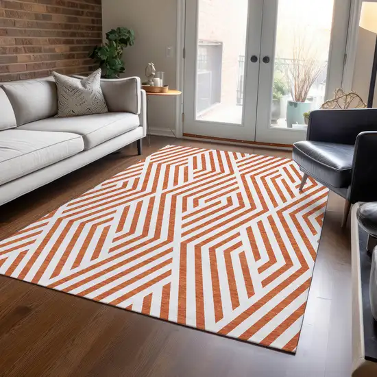 3' X 4' Orange and White Geometric Washable Non Skid Indoor Outdoor Area Rug Photo 9