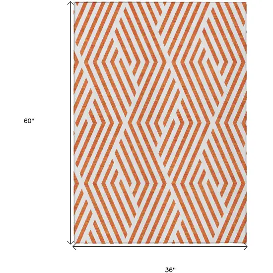 3' X 5' Orange and White Geometric Washable Non Skid Indoor Outdoor Area Rug Photo 3