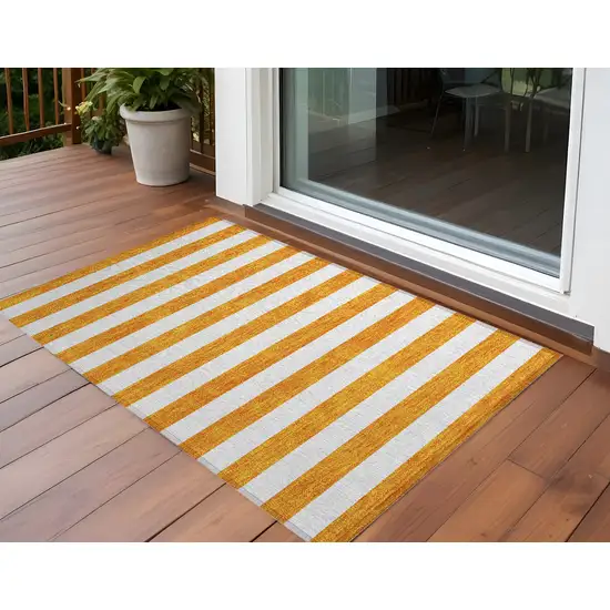 3' X 4' Orange and White Striped Washable Non Skid Indoor Outdoor Area Rug Photo 1