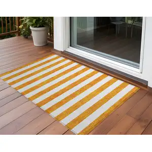 Photo of 3' X 4' Orange and White Striped Washable Non Skid Indoor Outdoor Area Rug