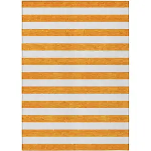 Photo of 3' X 5' Orange and White Striped Washable Non Skid Indoor Outdoor Area Rug