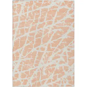 Photo of 3' X 4' Peach and Ivory Abstract Washable Non Skid Indoor Outdoor Area Rug