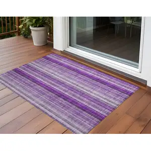 Photo of 3' X 5' Purple Striped Washable Non Skid Indoor Outdoor Area Rug