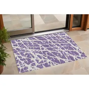 Photo of 3' X 4' Purple and White Abstract Washable Non Skid Indoor Outdoor Area Rug