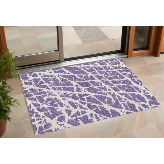 3' X 4' Purple and White Abstract Washable Non Skid Indoor Outdoor Area Rug Photo 1