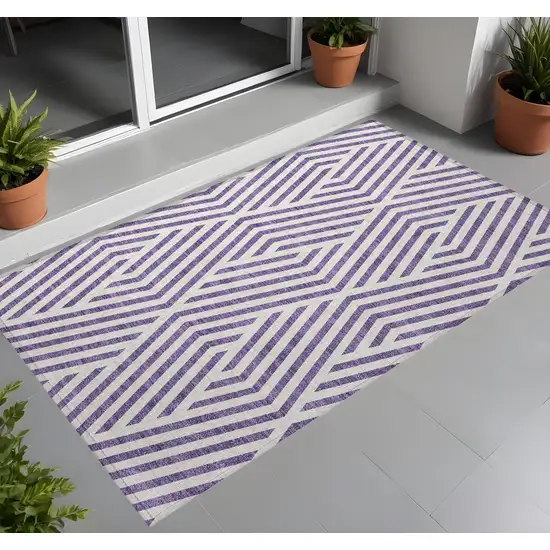 3' X 5' Purple and White Geometric Washable Non Skid Indoor Outdoor Area Rug Photo 1