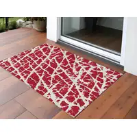 Photo of 3' X 5' Red and White Abstract Washable Non Skid Indoor Outdoor Area Rug