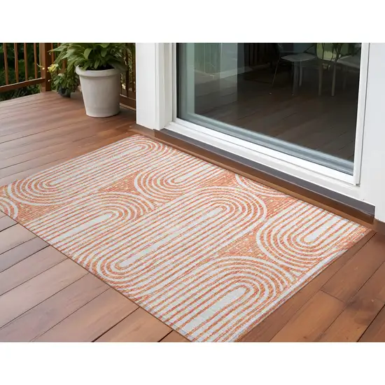 Orange and Ivory Abstract Washable Non Skid Indoor Outdoor Area Rug Photo 1