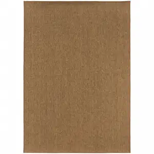 Photo of 9' X 13' Tan Stain Resistant Indoor Outdoor Area Rug