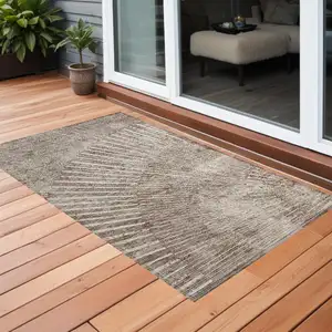 Photo of 3' X 5' Taupe and Ivory Abstract Washable Non Skid Indoor Outdoor Area Rug