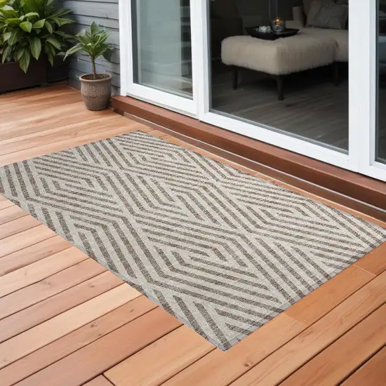 Taupe and Ivory Geometric Washable Non Skid Indoor Outdoor Area Rug Photo 1