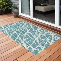 Photo of 3' X 5' Teal Abstract Washable Non Skid Indoor Outdoor Area Rug