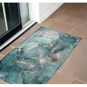 Photo of 3' X 4' Teal Abstract Washable Non Skid Indoor Outdoor Area Rug