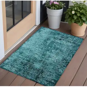 Photo of 3' X 5' Teal Abstract Washable Non Skid Indoor Outdoor Area Rug