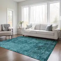 Photo of 3' X 5' Teal Abstract Washable Non Skid Indoor Outdoor Area Rug