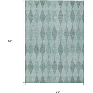 Photo of 3' X 5' Teal Geometric Washable Non Skid Indoor Outdoor Area Rug