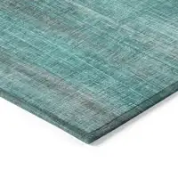 Photo of 3' X 4' Teal Striped Washable Non Skid Indoor Outdoor Area Rug