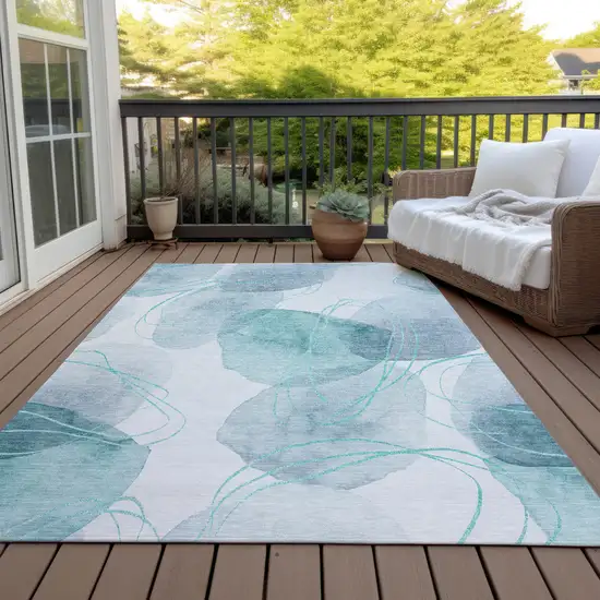 Teal and Ivory Abstract Washable Non Skid Indoor Outdoor Area Rug Photo 7