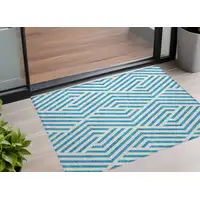 Photo of 3' X 4' Teal and White Geometric Washable Non Skid Indoor Outdoor Area Rug