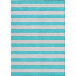 Photo of 3' X 4' Turquoise Striped Washable Non Skid Indoor Outdoor Area Rug