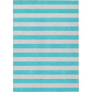 Photo of 3' X 5' Turquoise Striped Washable Non Skid Indoor Outdoor Area Rug